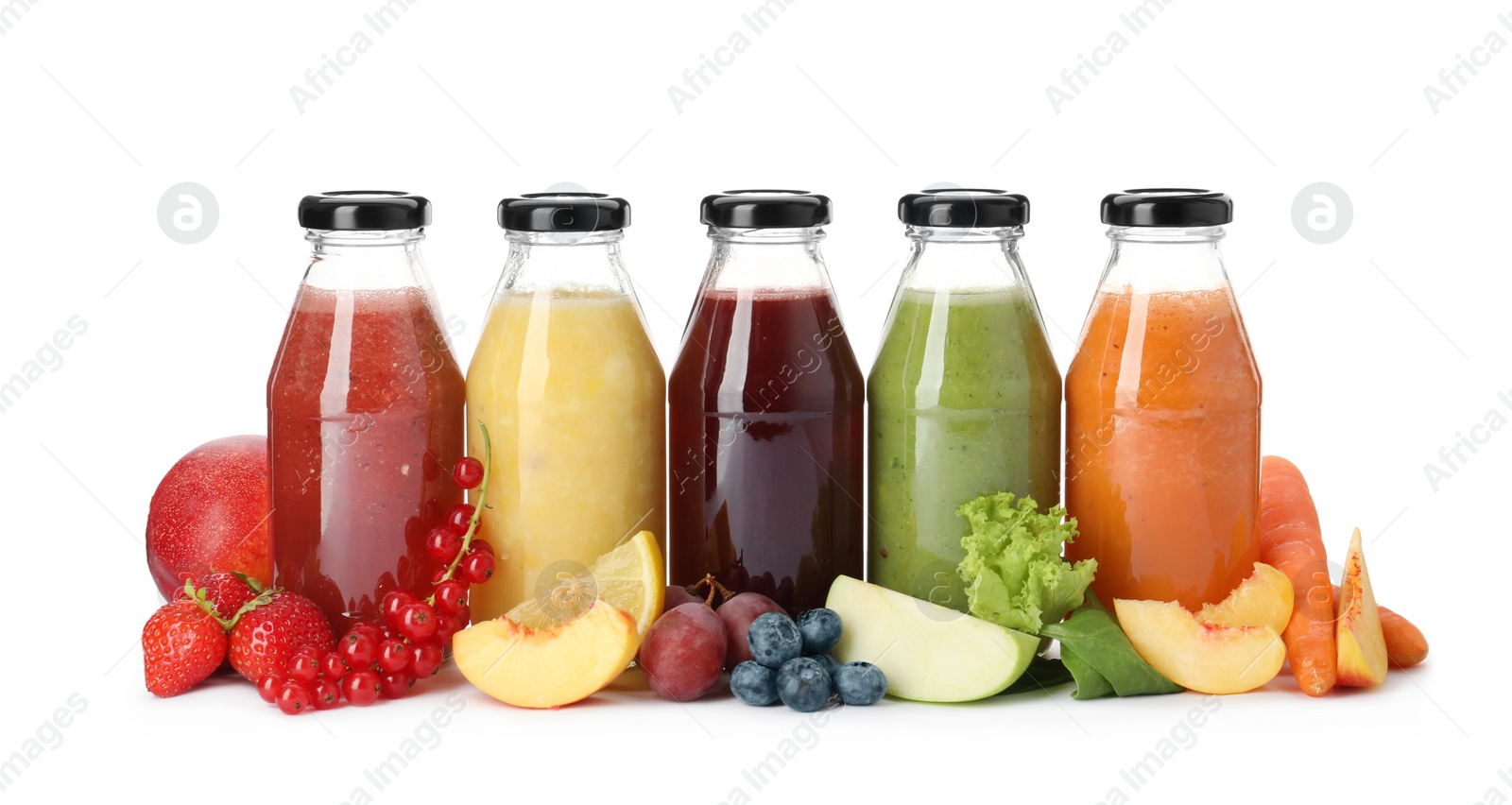 Photo of Bottles of delicious juices and fresh fruits on white background