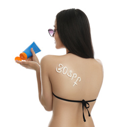 Photo of Text 30 SPF written with sun protection cream on woman's back against white background