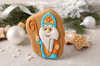 Tasty gingerbread cookie and festive decor on light table. St. Nicholas Day celebration