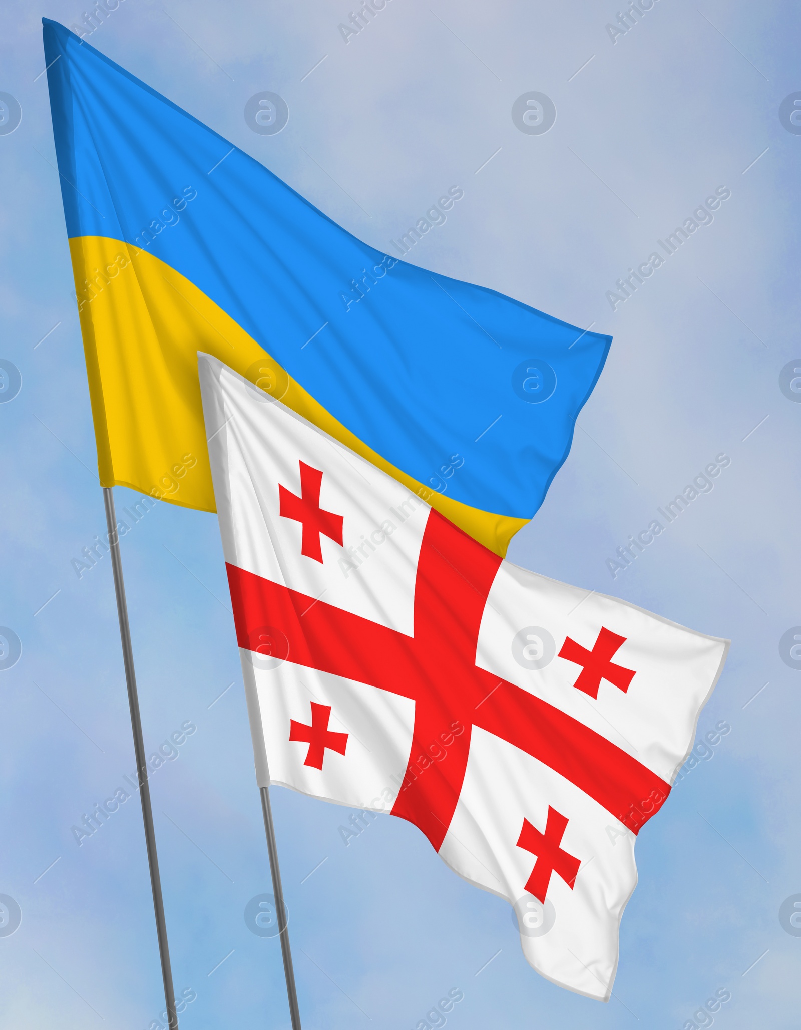 Image of National flags of Ukraine and Georgia against sky