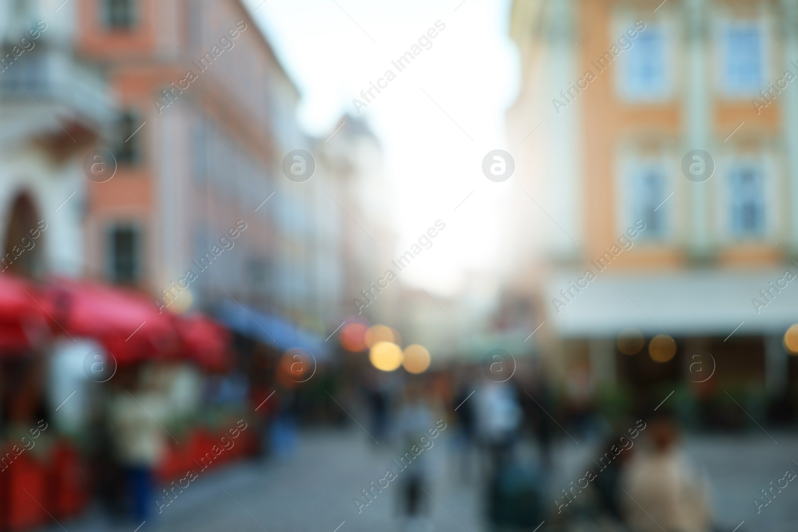 Photo of Blurred view of people walking on city street