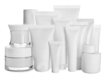 Photo of Blank tubes and jars of cosmetic products on white background