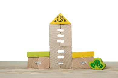 Photo of Set of toys on wooden table against white background. Children's development