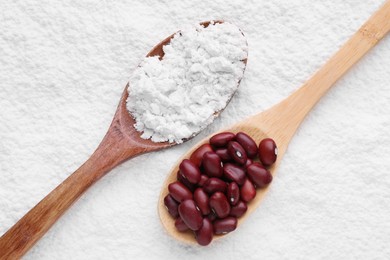 Photo of Brown seeds on kidney bean flour, flat lay