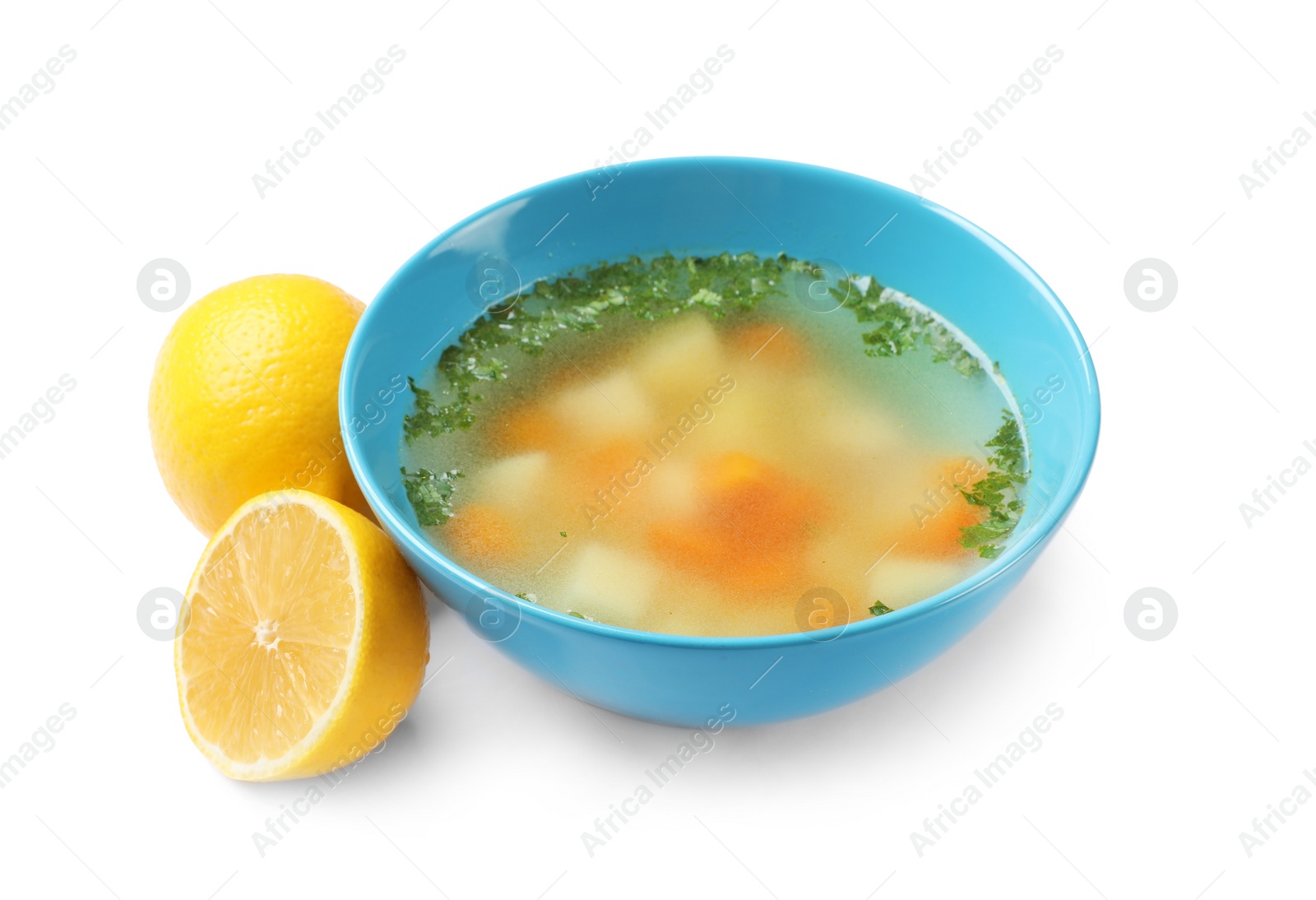 Photo of Bowl of fresh homemade soup to cure flu and lemons on white background