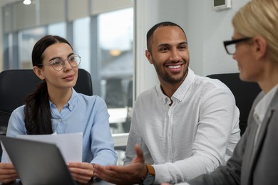 Lawyers working together at table in office