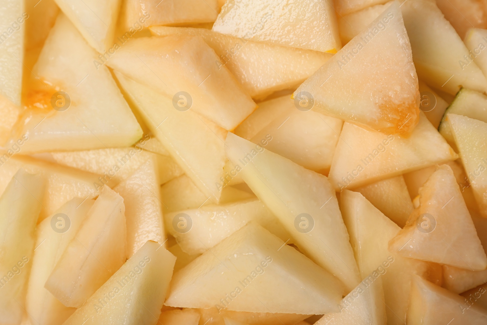 Photo of Ripe tasty melon slices as background, closeup view