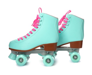 Photo of Pair of bright stylish roller skates on white background