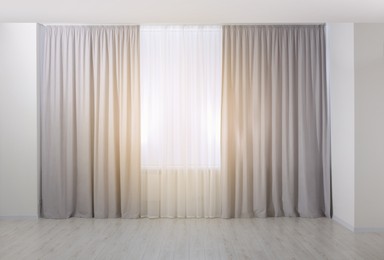 Light grey window curtains and white tulle indoors