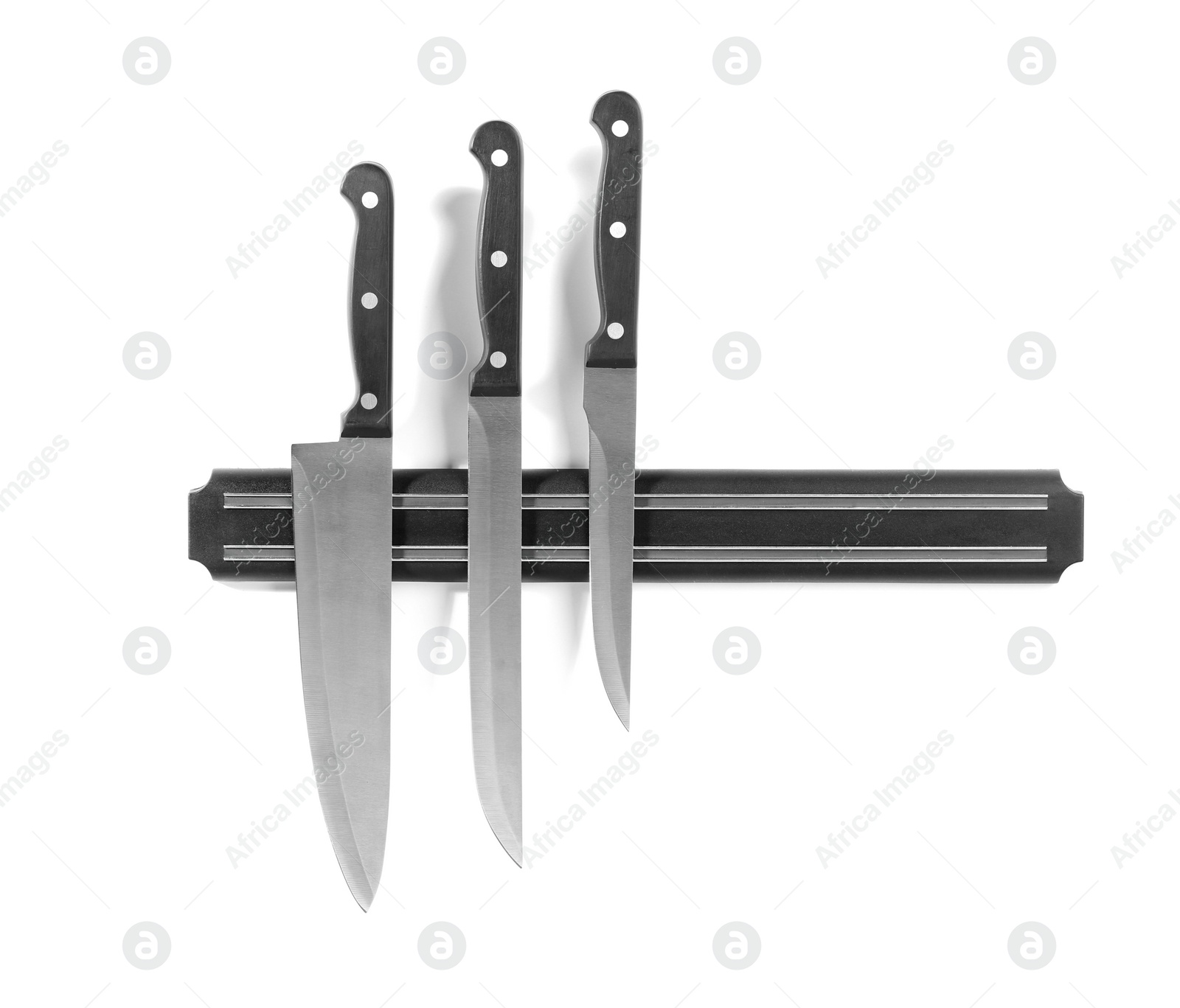 Photo of Magnetic holder with different knives isolated on white