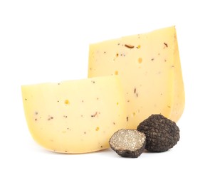 Photo of Pieces of delicious cheese with fresh black truffles on white background