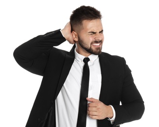 Businessman suffering from headache on white background