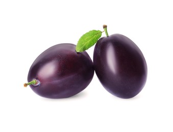 Photo of Delicious fresh ripe plums on white background