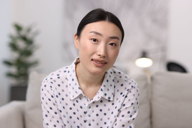 Photo of Portrait of smiling businesswoman wearing shirt in office