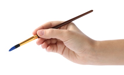 Photo of Young woman holding brush with color paint on white background, closeup