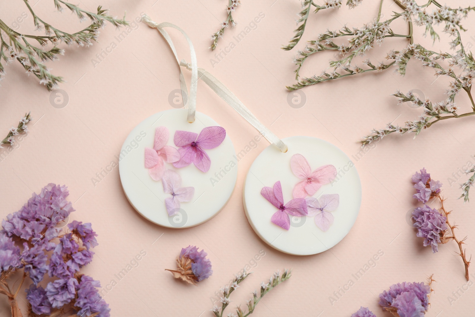 Photo of Flat lay composition with scented sachets on pink background