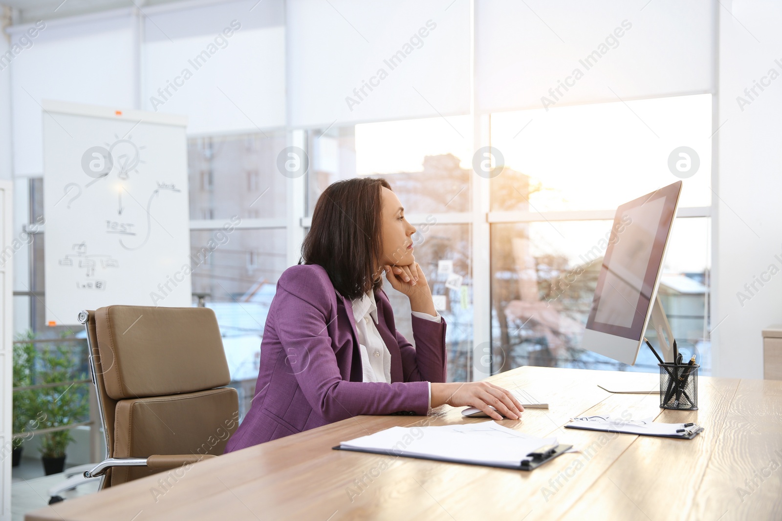 Photo of Woman relaxing in office chair at workplace