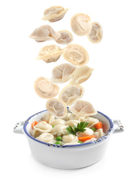 Image of Many tasty dumplings falling into bowl on white background