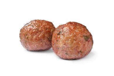 Photo of Two tasty cooked meatballs on white background