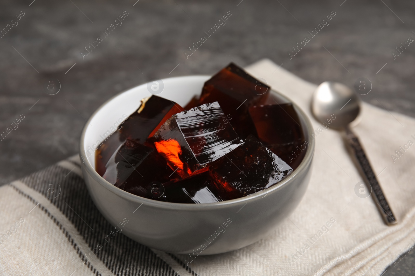 Photo of Delicious grass jelly cubes on table, closeup