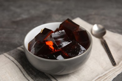 Photo of Delicious grass jelly cubes on table, closeup