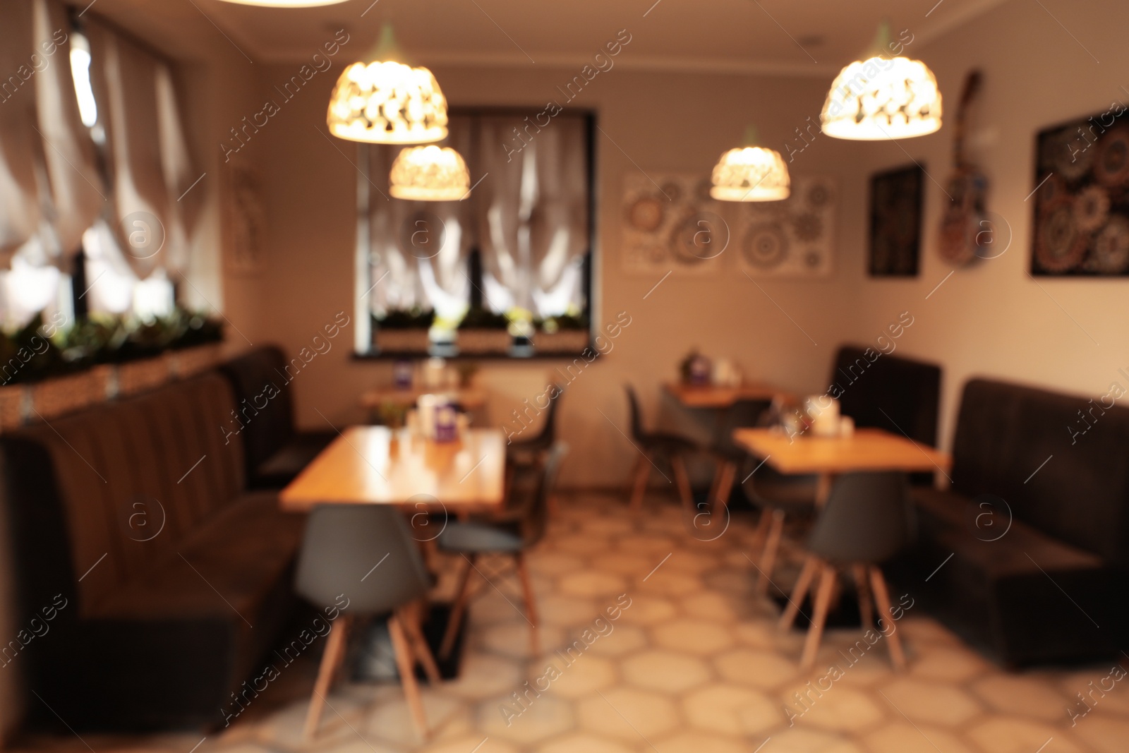 Photo of Blurred view of stylish modern cafe interior