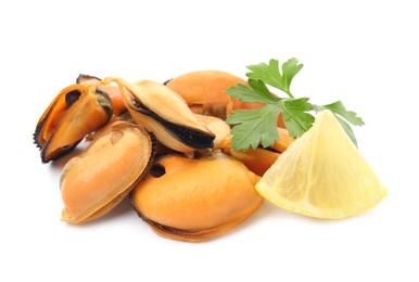 Delicious cooked mussels with parsley and lemon on white background