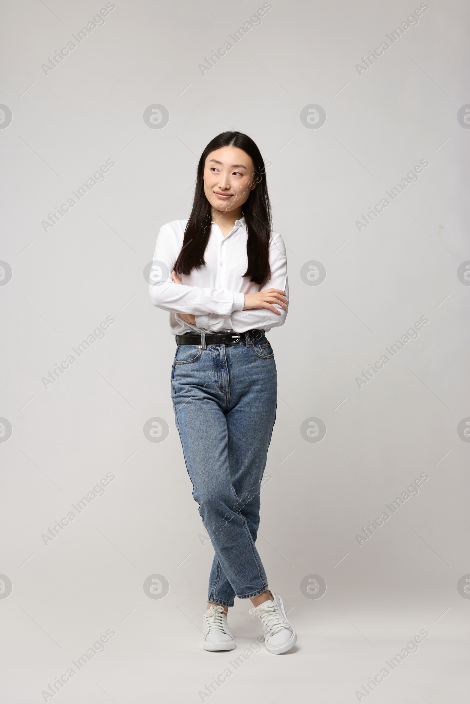 Photo of Full length portrait of beautiful woman on light background