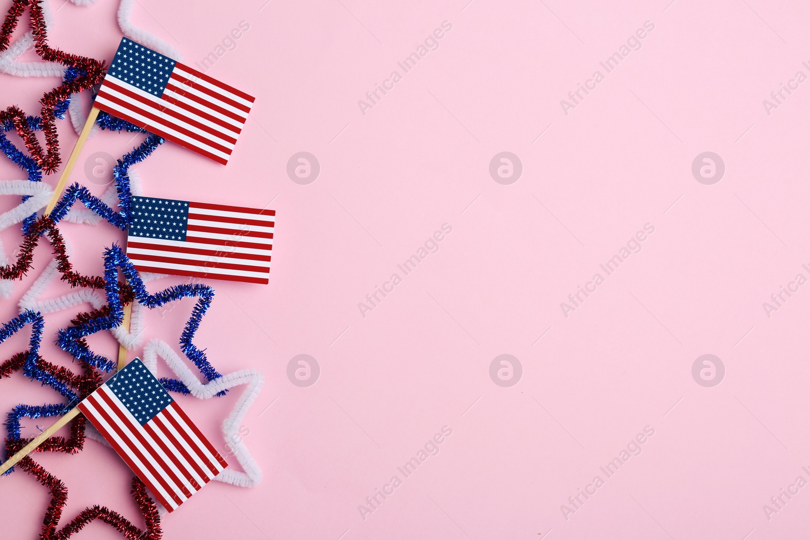 Photo of Flat lay composition with USA flags on color background, space for text. Happy Independence Day