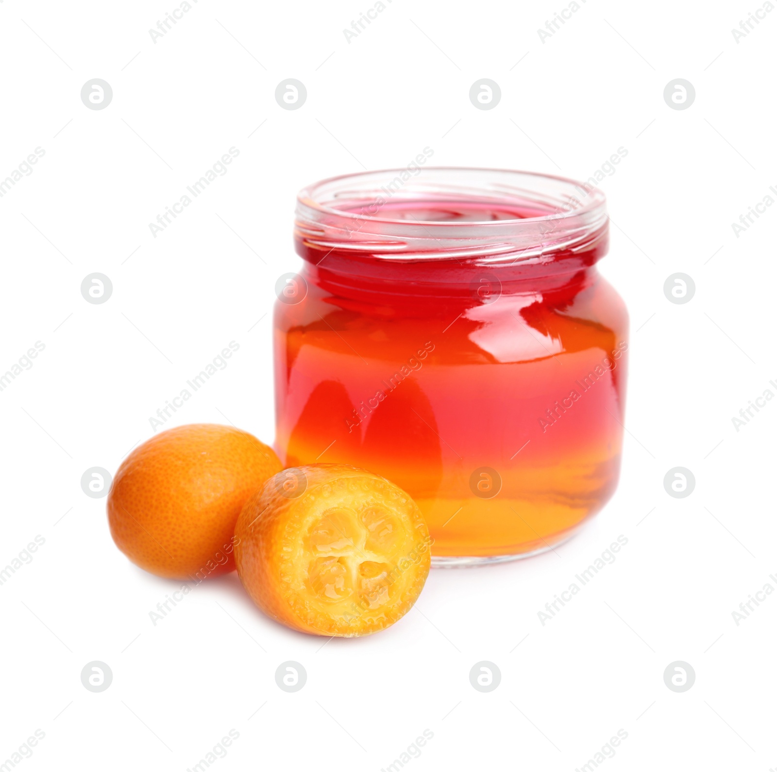 Photo of Kumquats and tasty layered jelly dessert in glass jar on white background