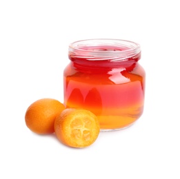 Photo of Kumquats and tasty layered jelly dessert in glass jar on white background