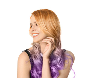 Image of Portrait of young woman with dyed long curly hair on white background