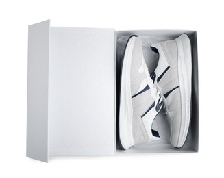 Photo of Pair of stylish sport shoes in box on white background, top view