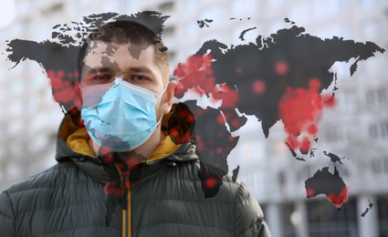 Image of Man wearing medical mask outdoors during coronavirus outbreak