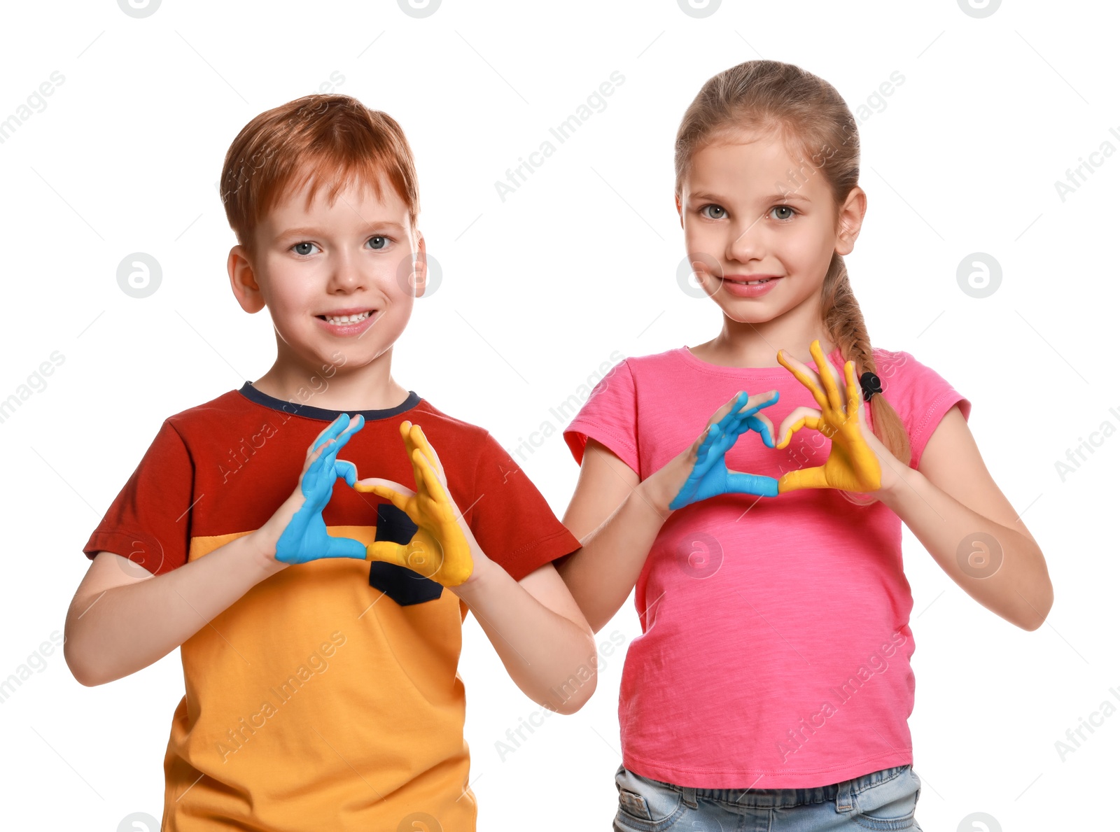 Photo of Little girl and boy making heart with their hands painted in Ukrainian flag colors on white background. Love Ukraine concept