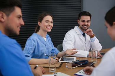 Team of professional doctors having meeting in office