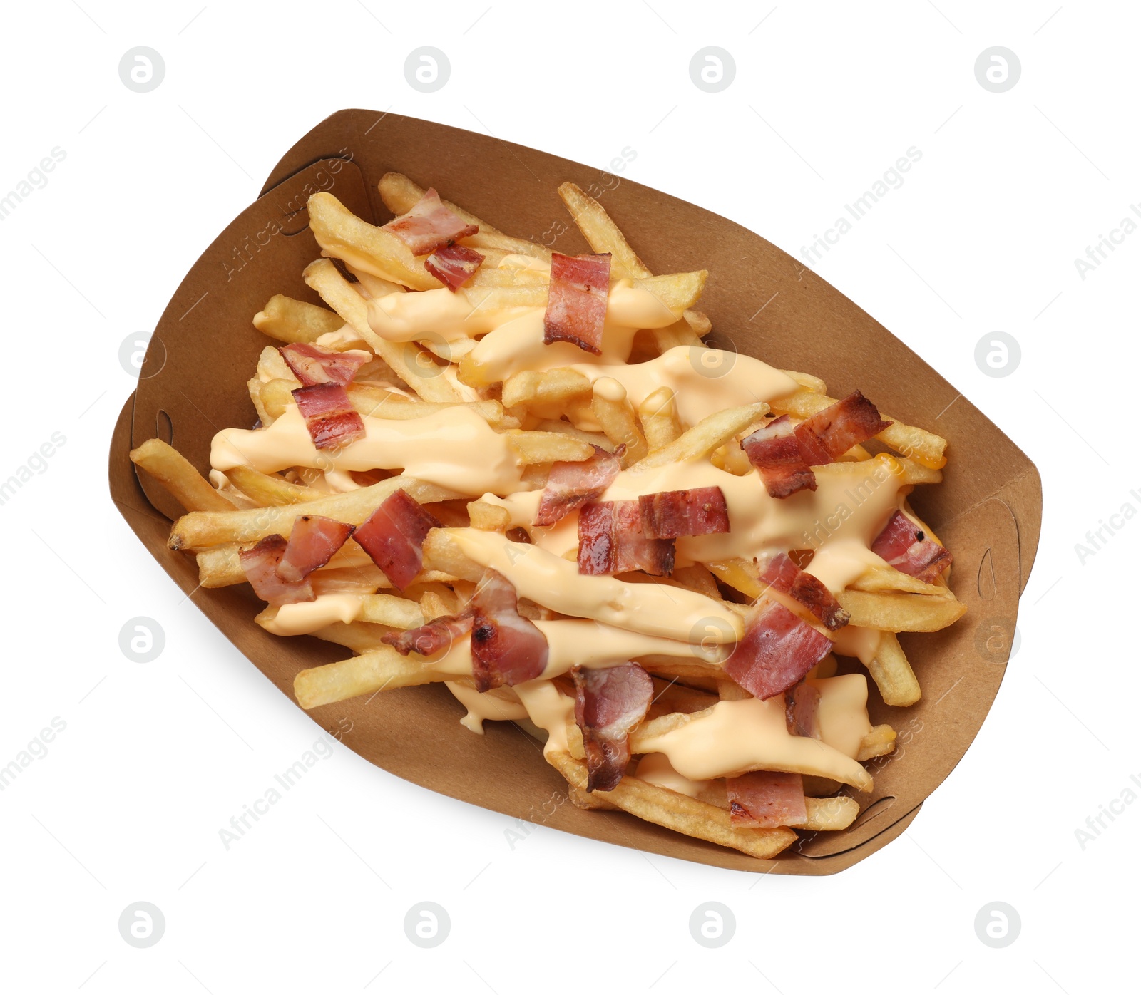 Photo of Tasty potato fries, cheese sauce and bacon in paper container isolated on white, top view