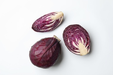 Fresh ripe cabbages on white background, flat lay. Organic vegetables