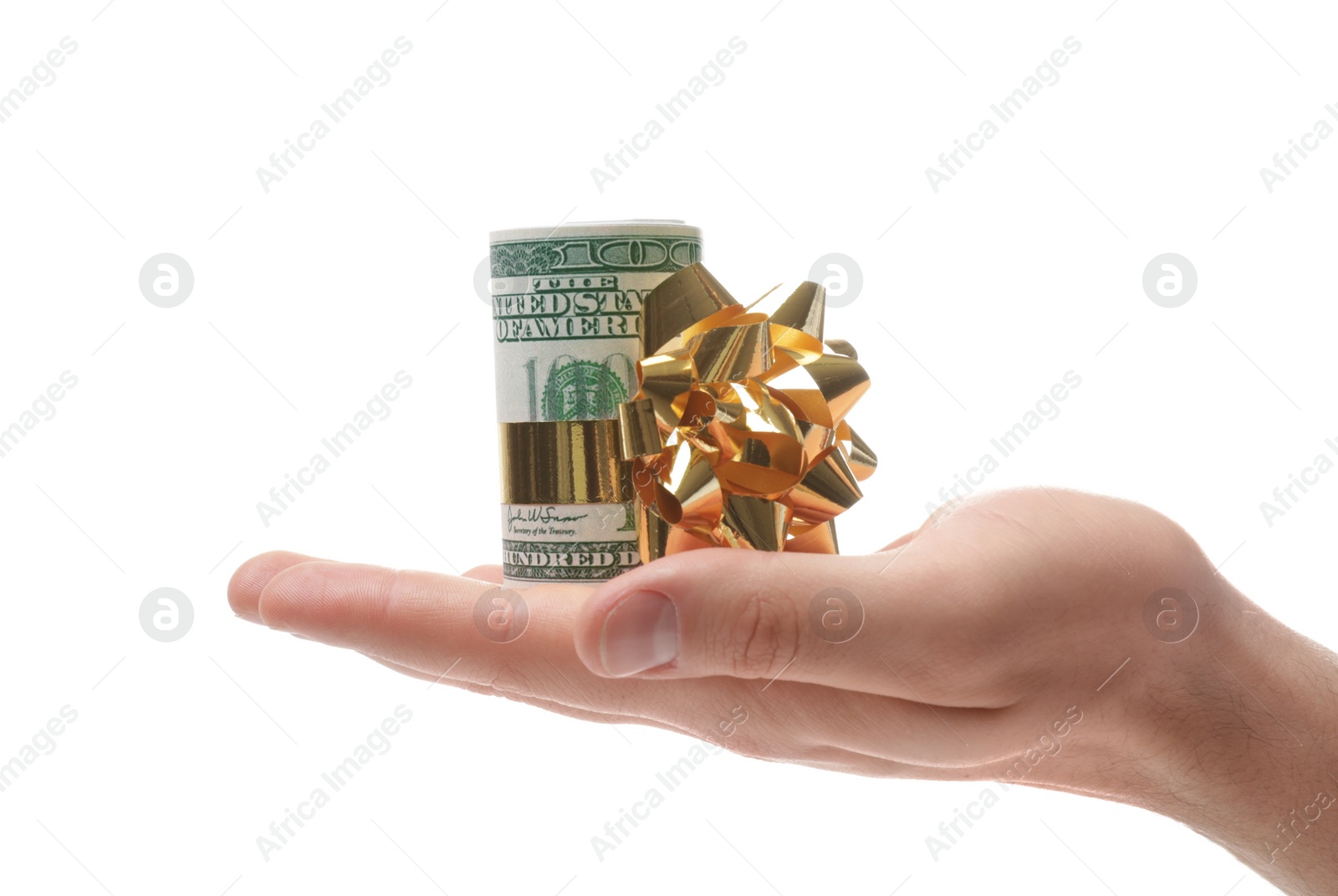 Photo of Man holding roll of dollar bills with bow on white background, closeup