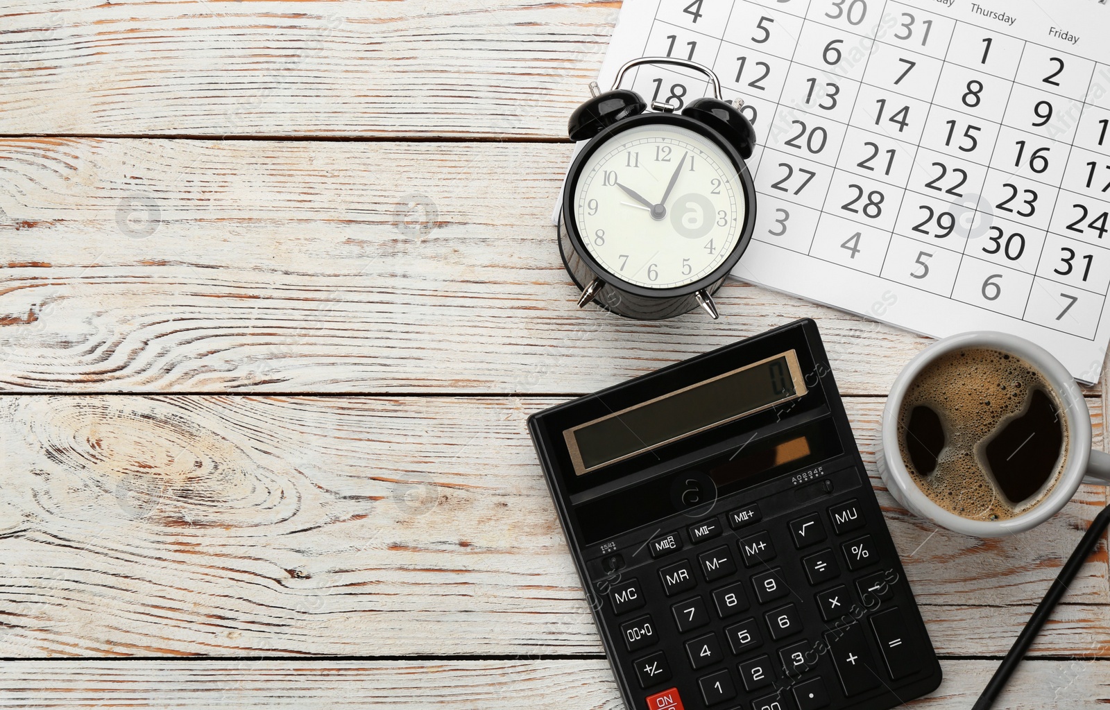 Photo of Flat lay composition with calendar and cup of coffee on white wooden table. Space for text