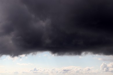 Photo of Sky with heavy rainy clouds on grey day