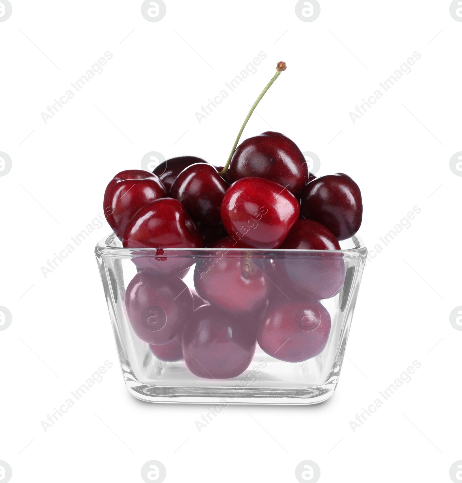 Photo of Tasty ripe red cherries in glass bowl isolated on white