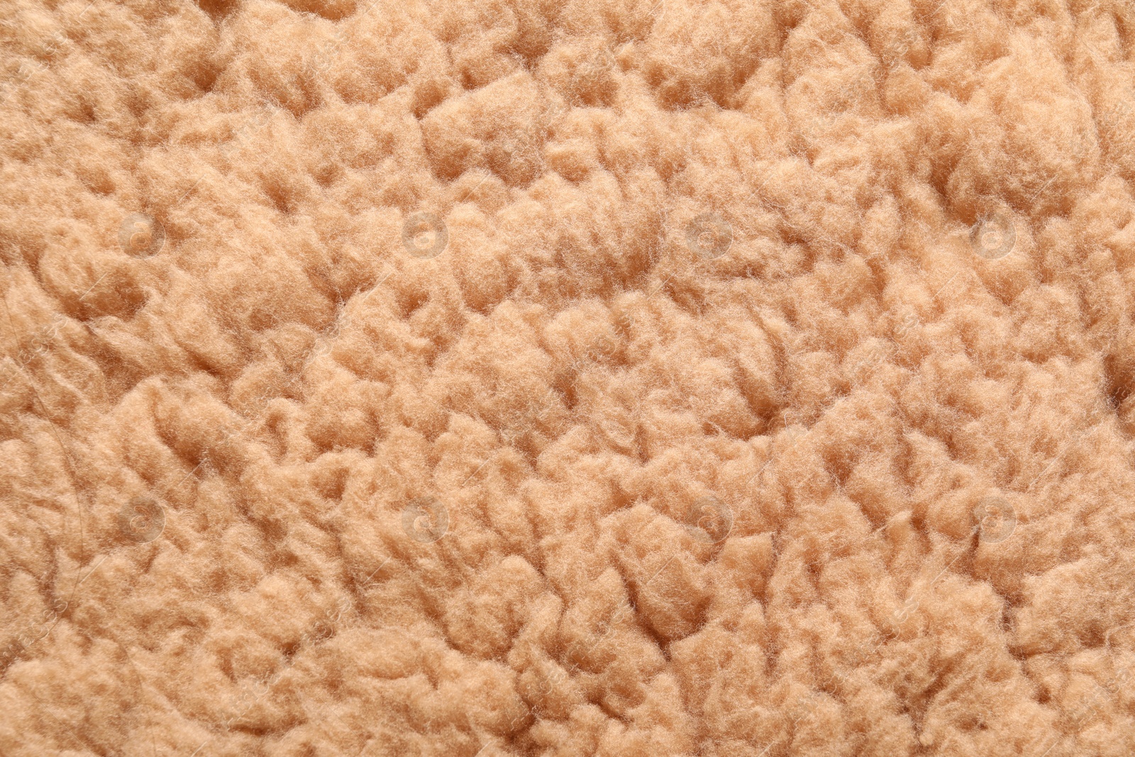 Photo of Texture of brown faux fur as background, closeup