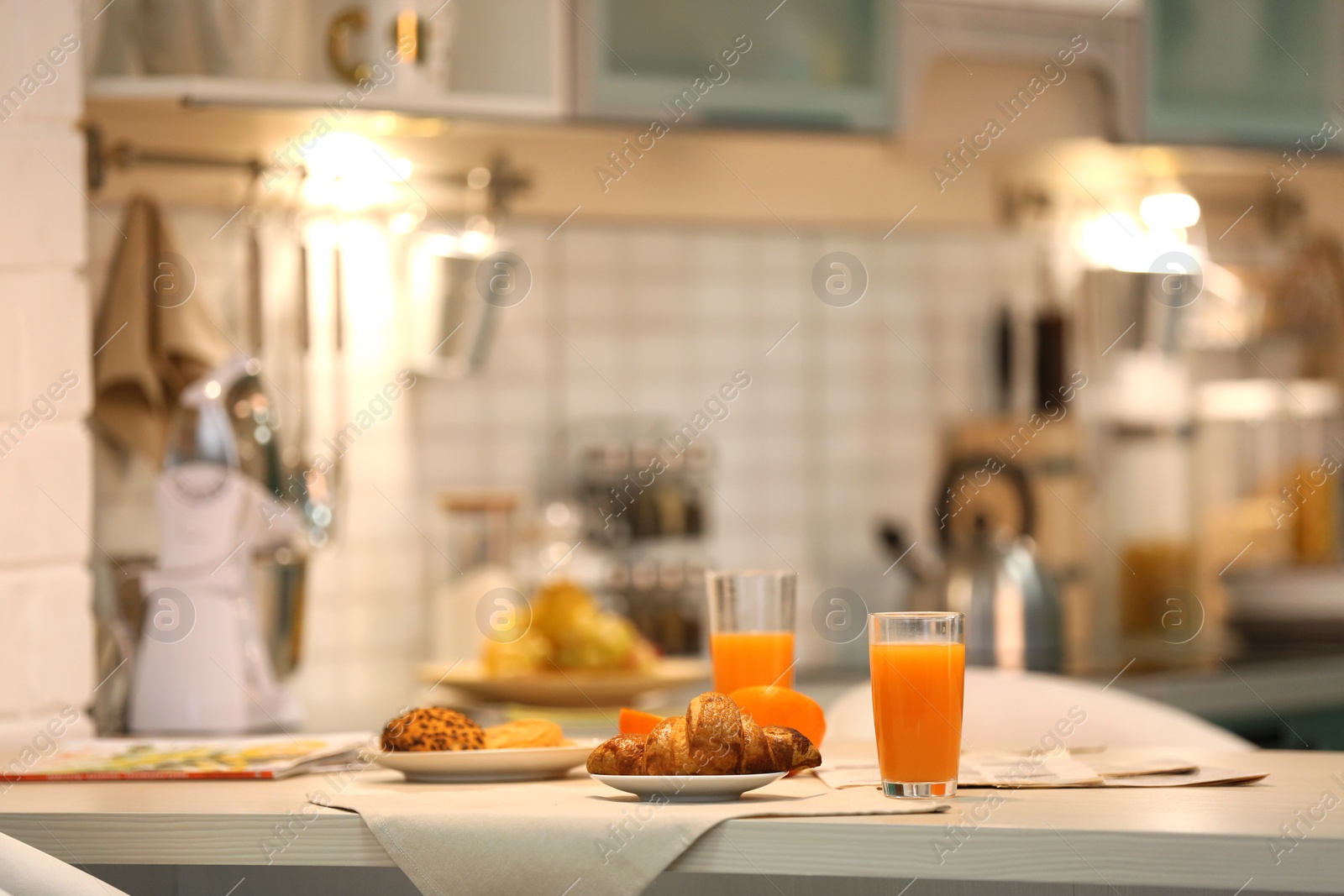 Photo of Served breakfast on table in modern kitchen