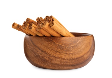 Aromatic dry cinnamon sticks in bowl on white background