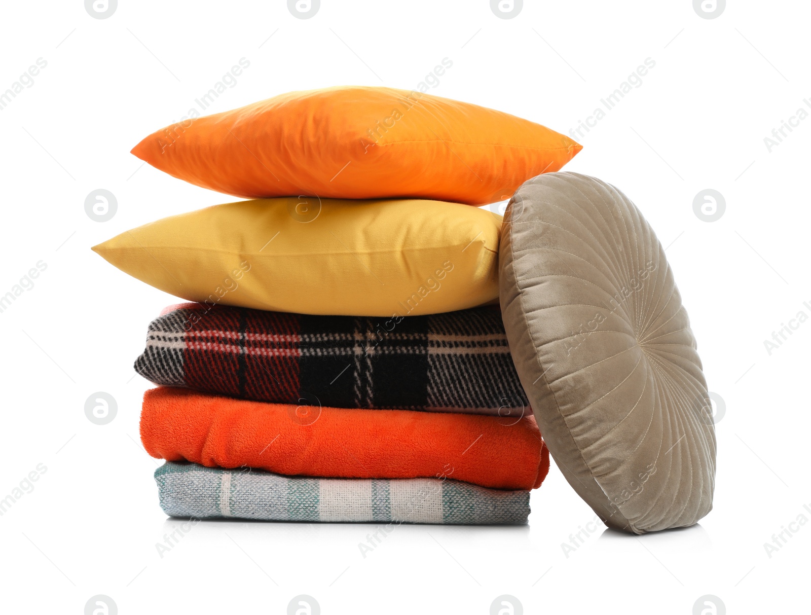 Photo of Stylish soft pillows and blankets on white background