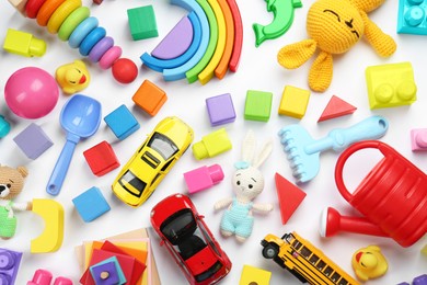 Photo of Different children's toys on white background, flat lay