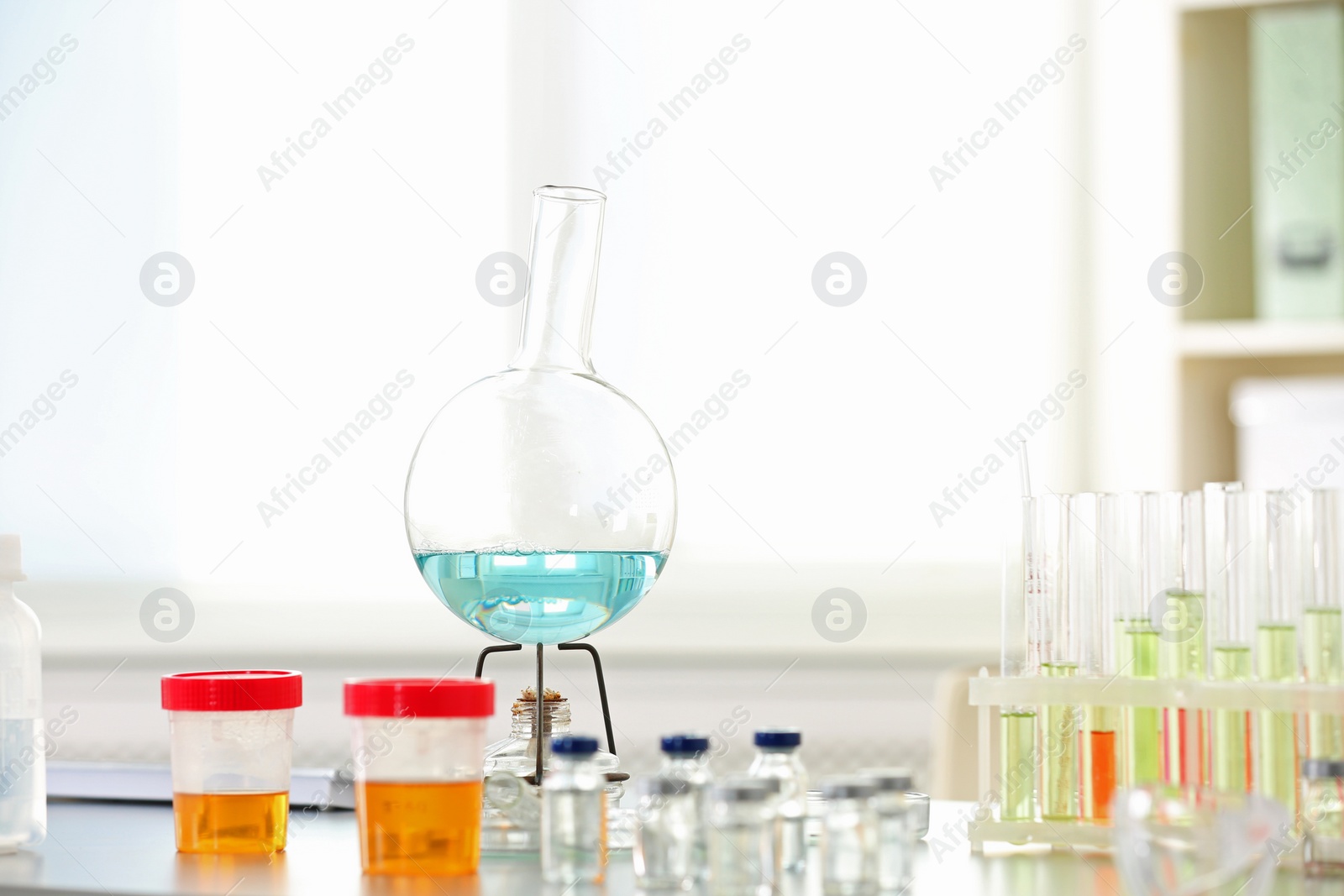 Photo of Laboratory glassware on table indoors. Research and analysis