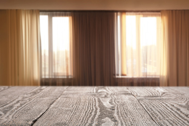 Image of Empty wooden table in room. Space for design