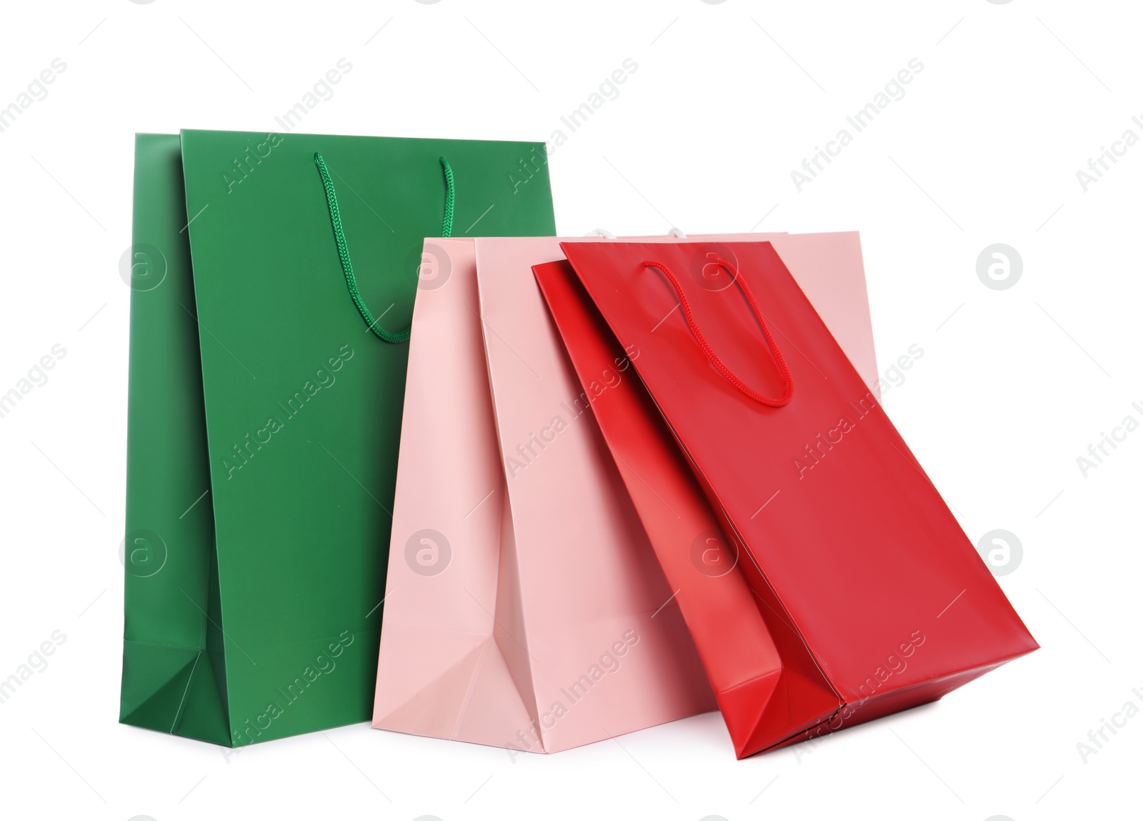 Photo of Colorful paper shopping bags isolated on white